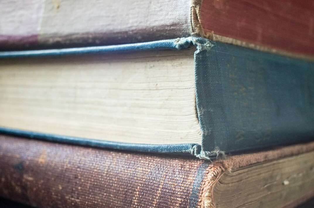 Stack of old books with worn covers
