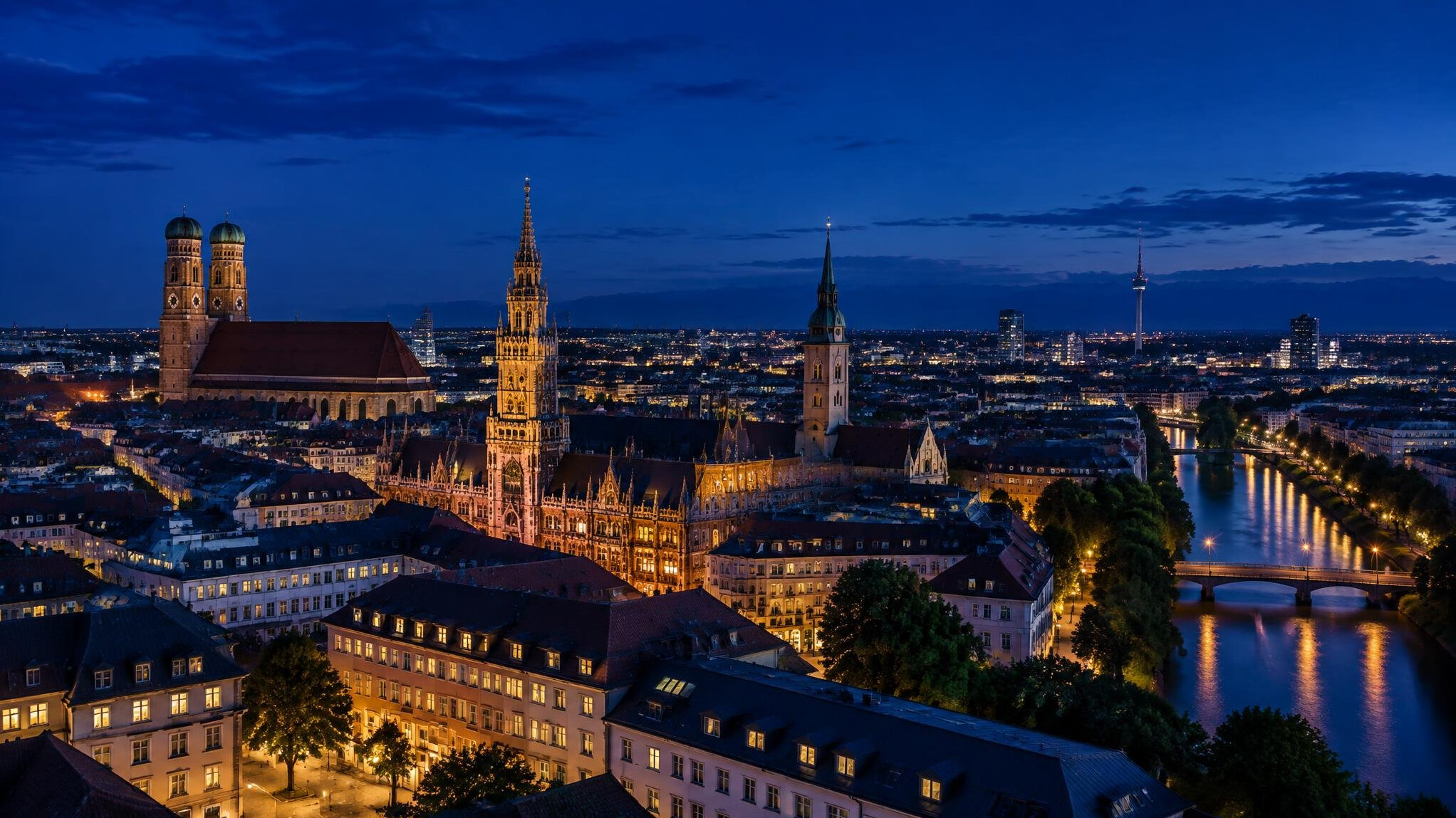City at night with lit windows and dark sky