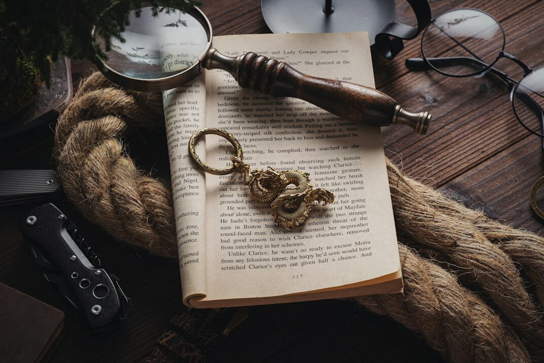 old book with magnifying glass